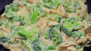 Chicken breast with broccoli in cream sauce.