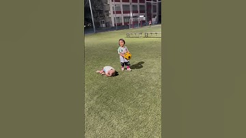 Boy trips during children’s soccer game in Kanie, Aichi, Japan