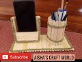 Home made pen holder and mobile phone holder with popsicle sticks