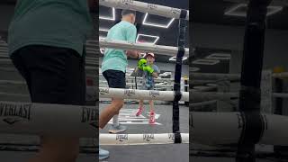 Tony Curtis fly weight professional British boxer on the pads with Freddie hayward age 9