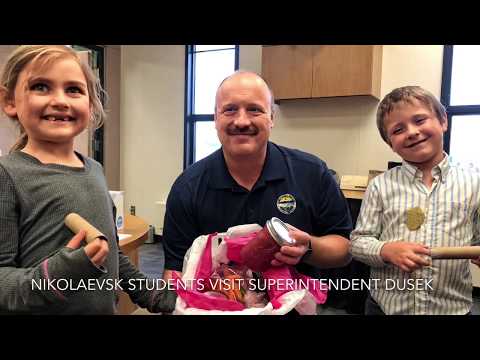 Nikolaevsk School students visit Superintendent Dusek