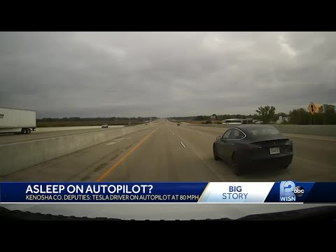 Tesla driver charged with being asleep behind wheel