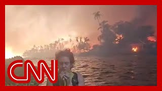 Dramatic video shows family escaping into ocean as Lahaina burns