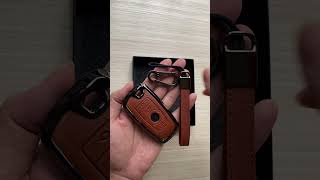 This car key cover slaps for BMW 4-button keys, constructed with premium leather and zinc alloy