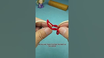 How can you skillfully separate the two red strings?#puzzle#iq#iqtest