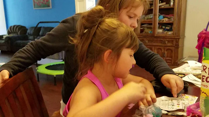 Gabrielle demonstrating how to open a blind bag