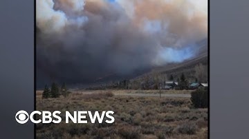 California wildfire forces evacuations and storms trigger mudslides concerns