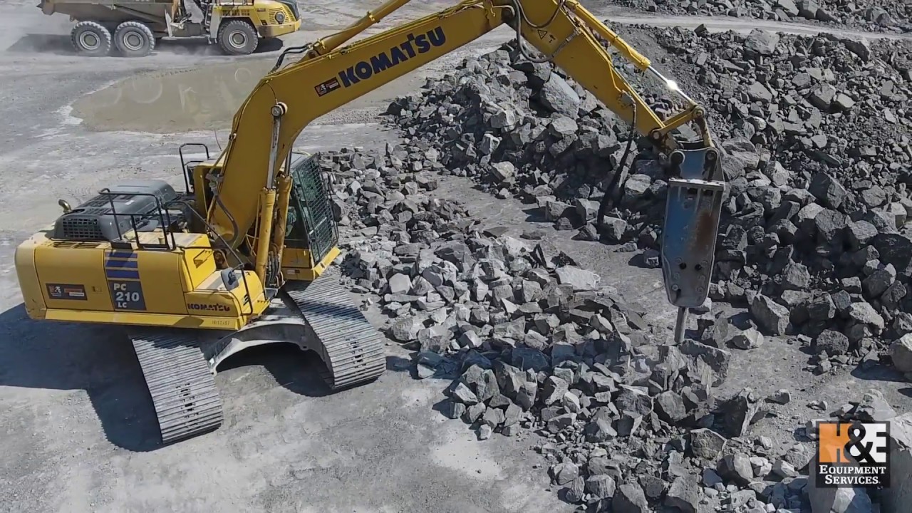 Komatsu PC210LC Excavator Breaking up Rock for Midwest Lime Company - H&E Equipment Services