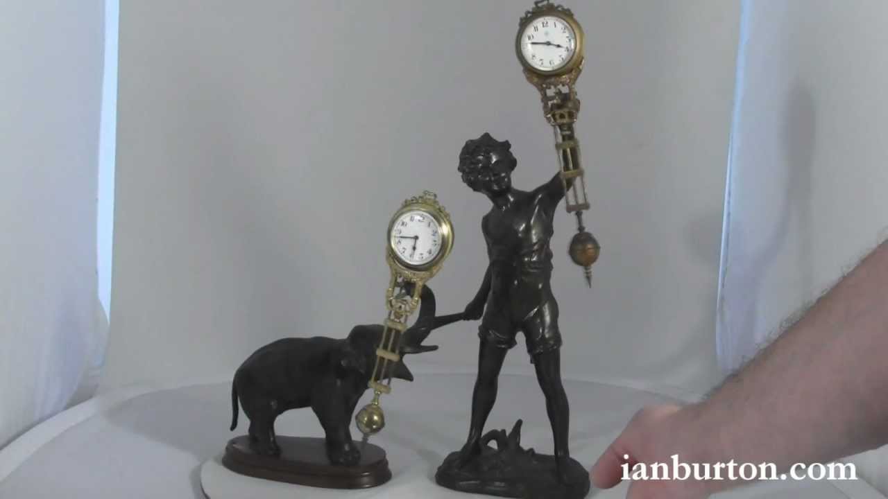 Two antique swinging mystery clocks by Junghans, Germany