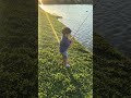 Toddler catches big Blue Tilapia in backyard