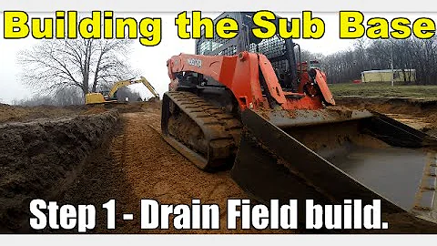 kubota slv90 finish grading sub base for drainfield with Cat316 bulking sand out