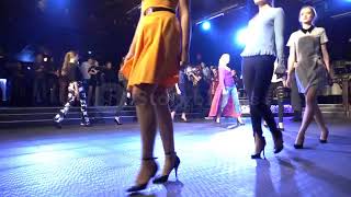 Fashion Show. Female Models Walk On The Catwalk In Beautiful Dresses. Slow Motion
