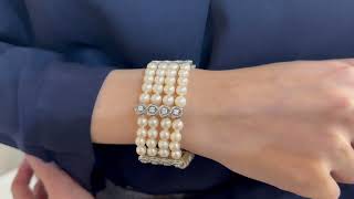 Vidéo: Bracelet en or gris 18 Cts avec 4 rangs de perles de culture et diamants brillants. 18 cm