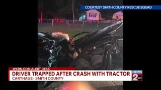 Driver trapped after crash with tractor