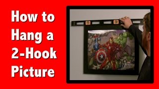 Learn how to quickly and easily hang a picture with 2 hooks.