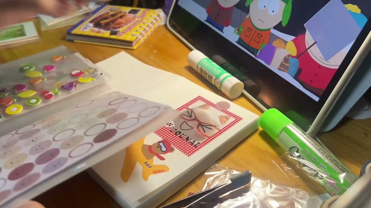 Watching South Park while decorating my new journal + chill music