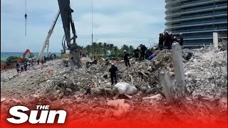 Rescue teams continue search after demolition of Surfside condo before Storm Elsa hits Florida