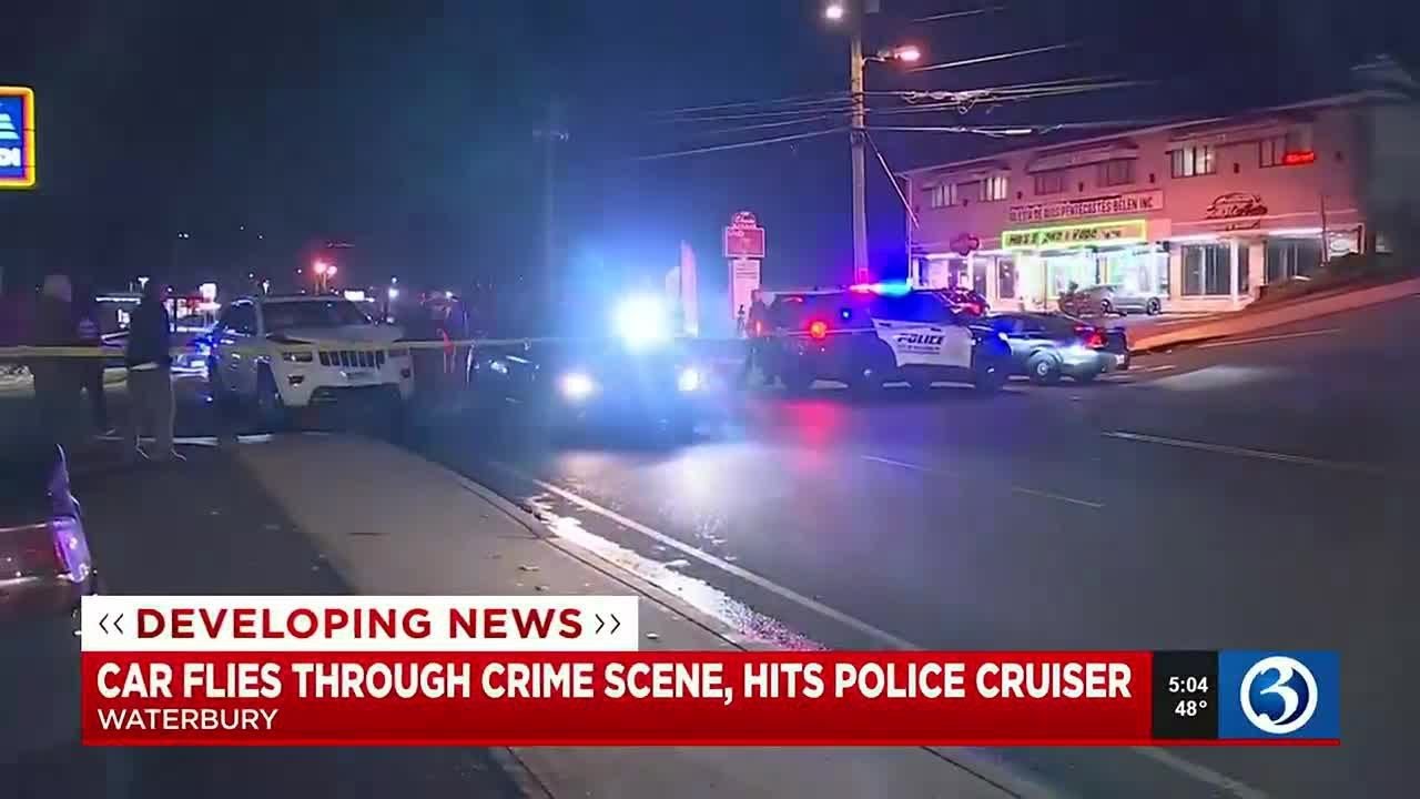 VIDEO: Suspect in custody after man drives into police scene in ...