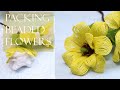 packing French beaded flowers to ship in the mail