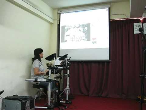 Irene Chan playing Drum