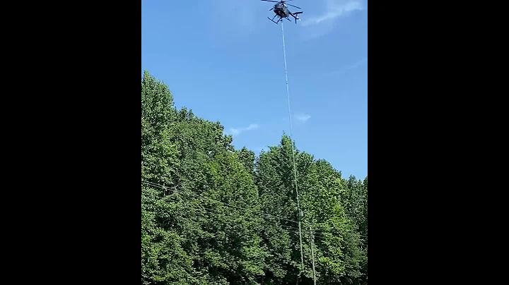 Helicopter with rotating saw blades trims trees in Alabama