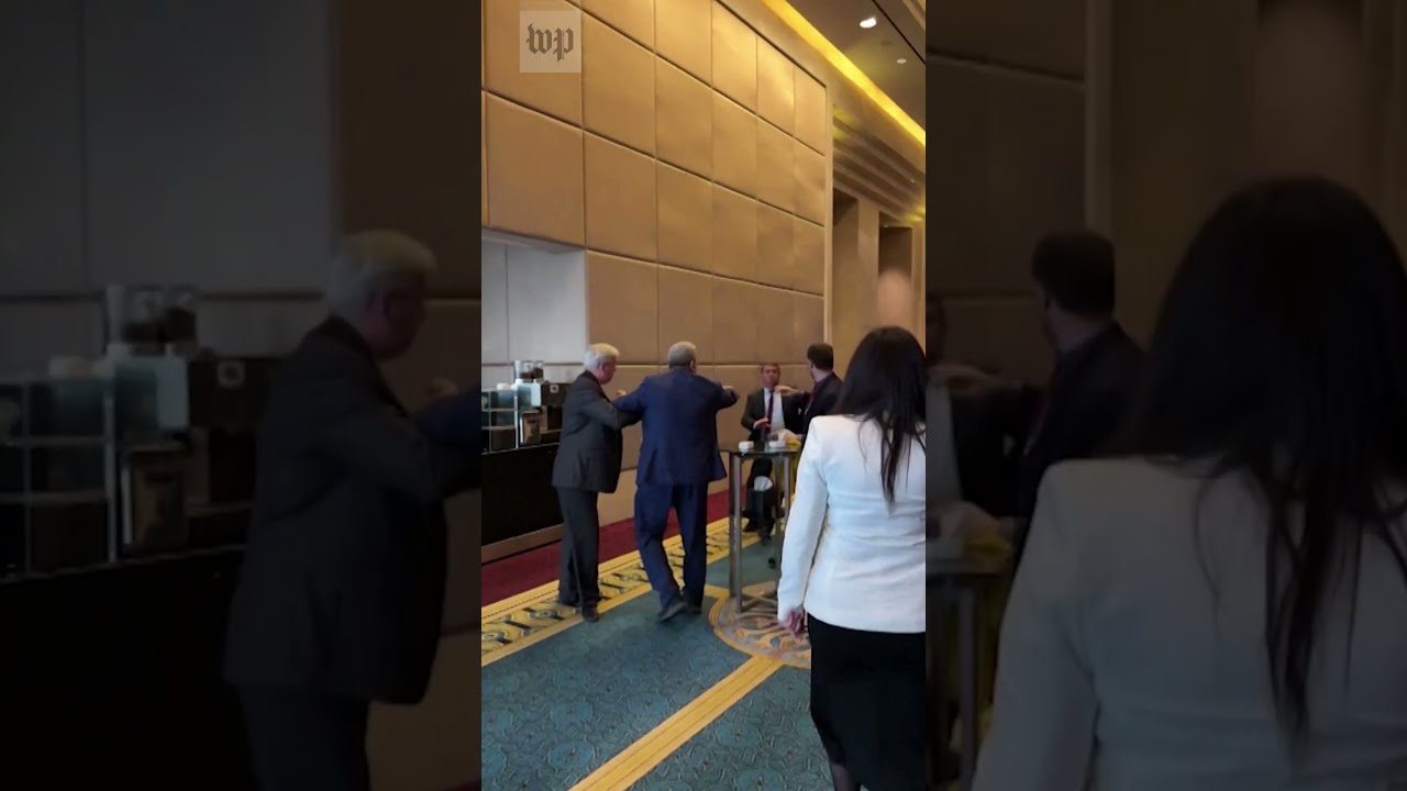 Russian And Ukrainian Delegates Fight For Flag At Conference