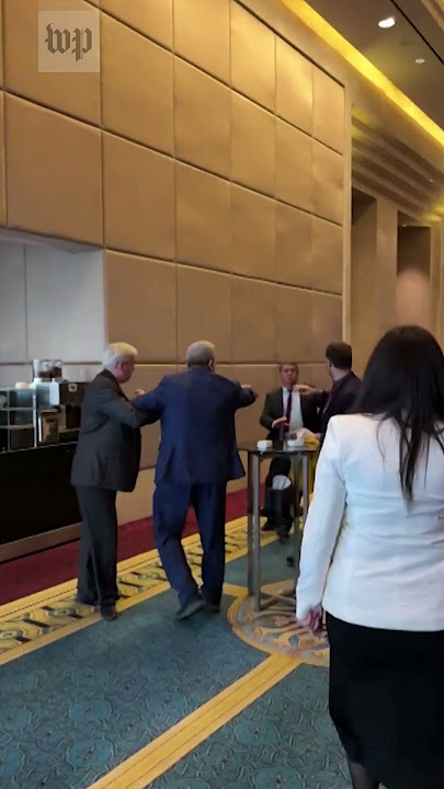 Russian and Ukrainian delegates fight for flag at conference