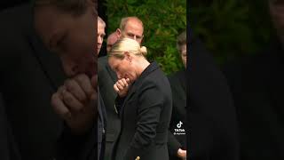 The Queen’s granddaughters Princess Eugenie and Zara Tindall inspected flowers left by mourners