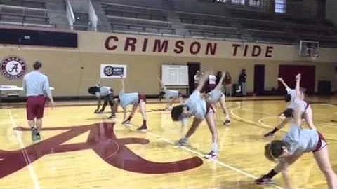 Charlie Rhea coaching a dynamic warm up for Alabam...