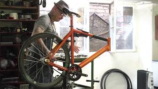time lapse technician creating bicycle in repair shop