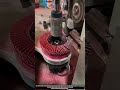 Precision flap disc trimming process using automated grinding setup in factory
