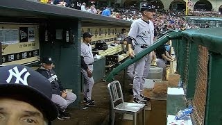I'M READY FOR MY CLOSE-UP! Joe Girardi gets up close and personal to fix dugout camera