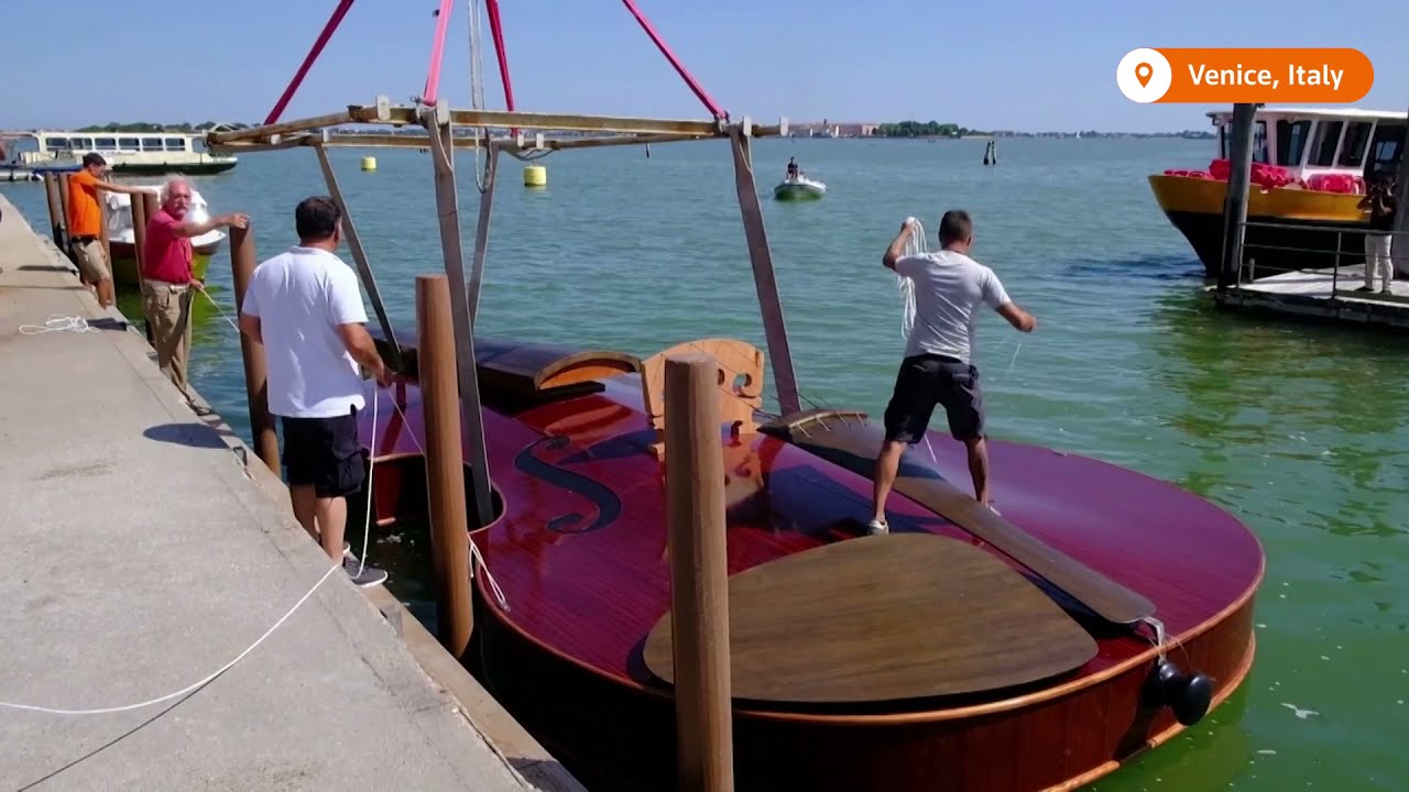 A Gigantic Violin Floats Down Venice's Grand Canal with a String