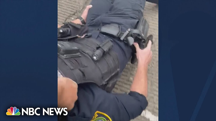 Watch: Good samaritan rescues wounded Houston police officer