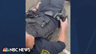 Watch: Good samaritan rescues wounded Houston police officer