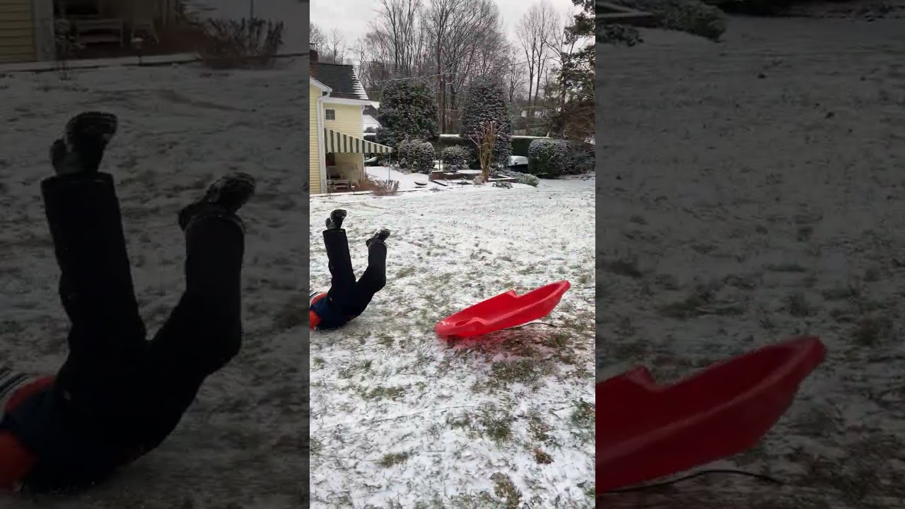 Boy goes downhill on sled then faceplants into scorpion position into snow