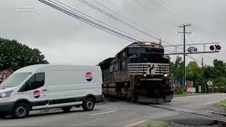 Heart-stopping moment van skids through railway barrier as train hurtles towards it | VIDEO