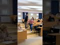 Teacher help mother in classroom