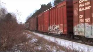 Freight Train Kicks Up Snow