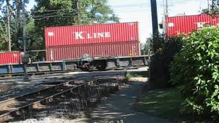WB UPRR Manifest Train Passes EB UPRR Container Train as Both Cross the CNRR @ W. Chicago IL.wmv