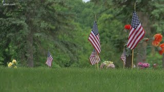 Honoring fallen heroes: Volunteers place 14,000 flags in memory of veterans at Toledo Memorial Park