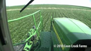 John Deere 4730 drives over camera - soybean level view