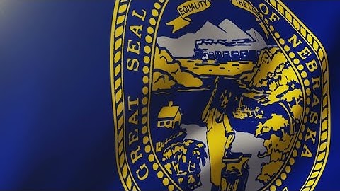 Nebraska Flag Waving In The Wind. Looping Sun Rises Style. Animation Loop Stock Animation