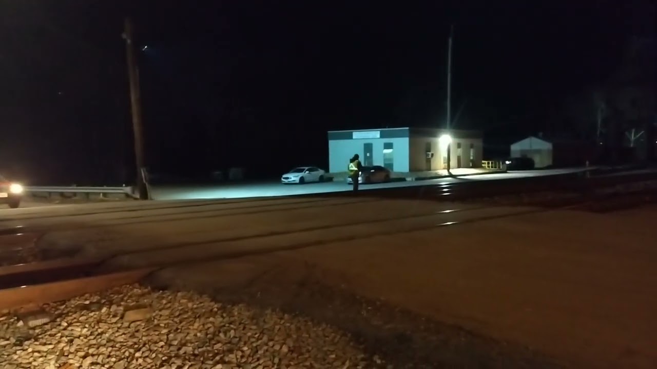 Truck races to beat train across train crossing