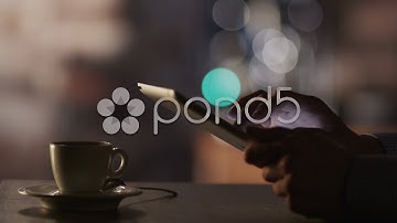 Man Using Tablet Pc And Drinking Coffee In Cafe 4K. Stock Footage