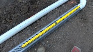 Channel Drain set in new patio solves flooded crawl space issues