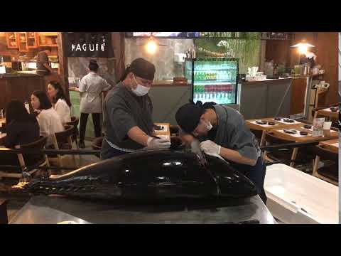 Chef at Maguro Japanese restaurant cutting fish Esplanade Bangkok Thailand