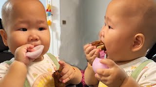 Cute Twin Brothers Momentthe Cute Baby Eats One Bite Of Meat And One Bite Of Onion So Delicious