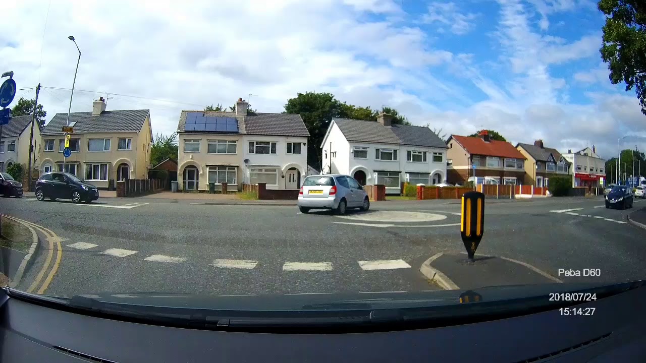 UK dashcam hesitant at mini roundabout