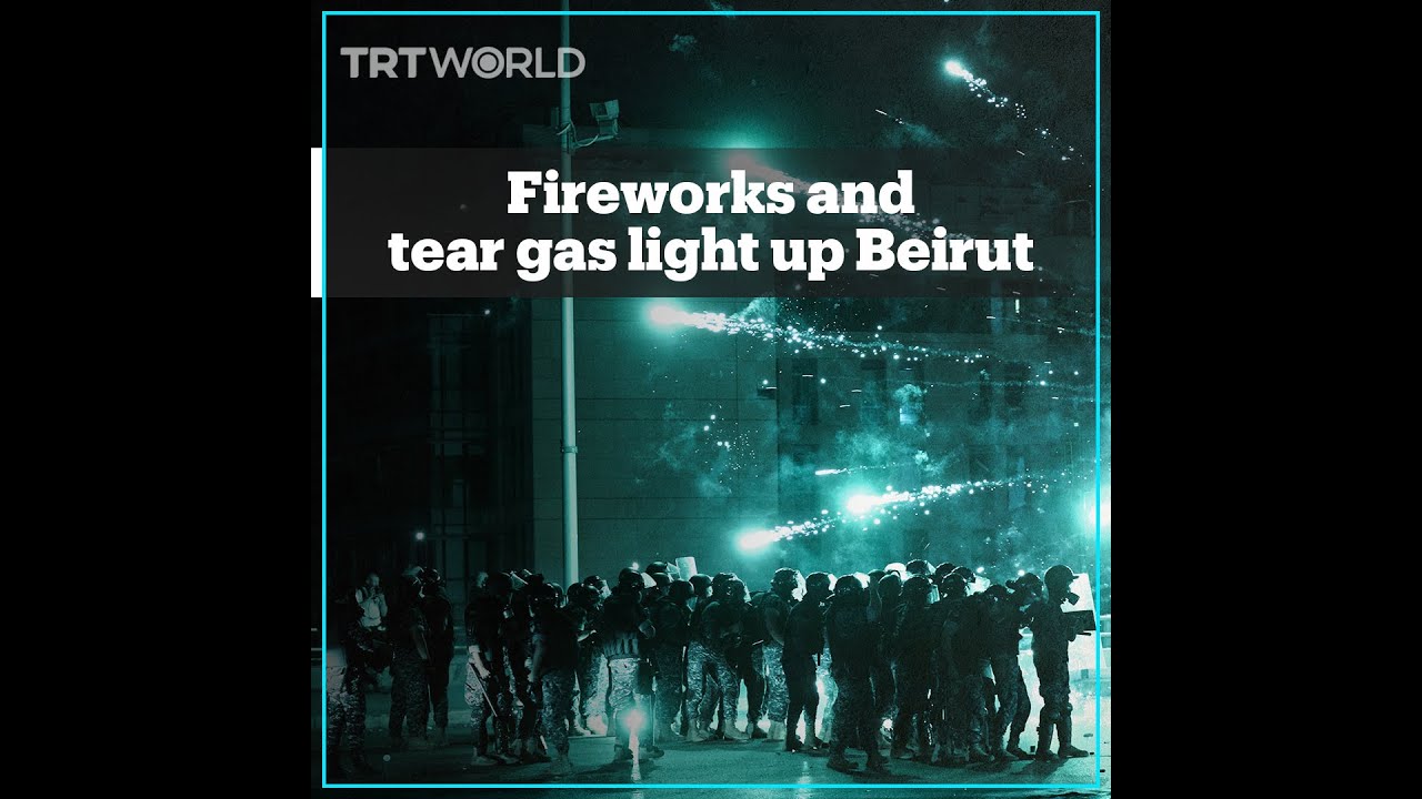 Fireworks and tear gas light up Beirut after PM resigns